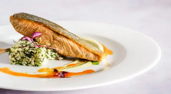 Cooked Trout on a plate.
