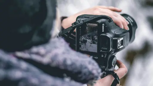 Photography: Student with professional camera equipment